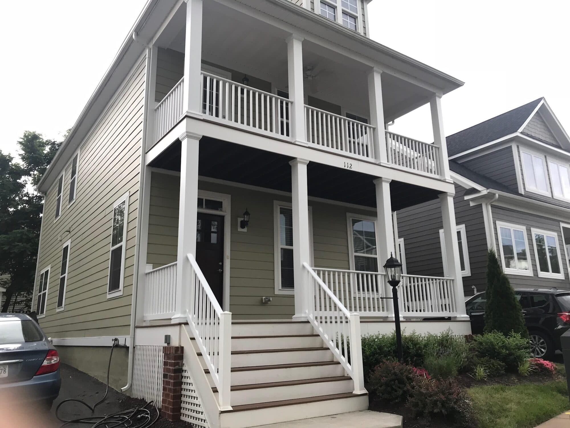 Repainted two-story residential exterior and porch
