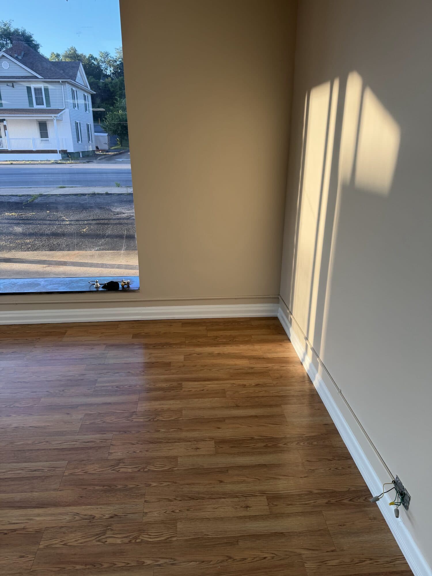 Interior room with freshly painted walls and white trim